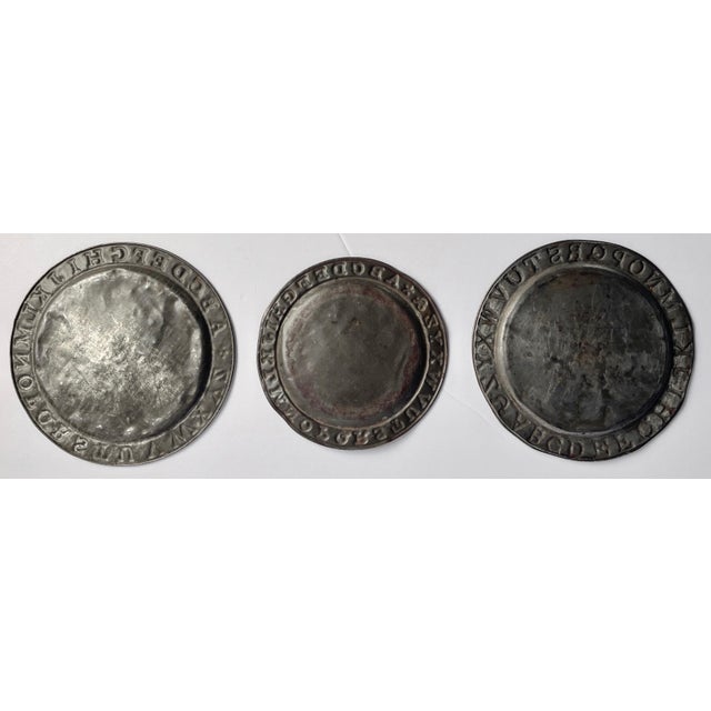 A charming collection of antique plates with the alphabet embossed around the rims. Great to add to a shelf or wall...