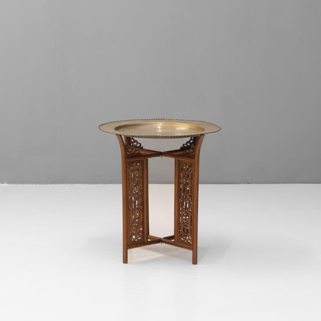 Brass dish top tray table with folding base. Circa 1930. H 61cm x W 57cm x D 57cm