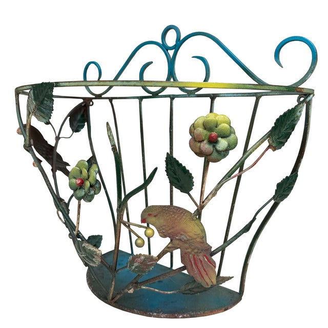 A wonderfully whimsical mid-20th-century painted-metal wall planter or plant holder, likely Continental European and...