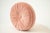 Soft and romantic, this round blush pink throw pillow features a gathered, smocked center that adds charming texture and...