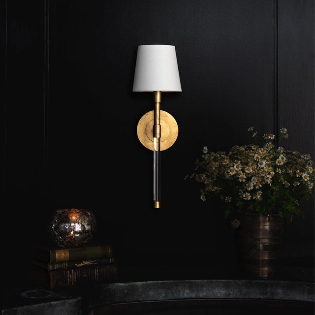 Our Auburn Sconce combines crystal and gold leaf to create a dramatic effect. A bold, circular backplate creates a...