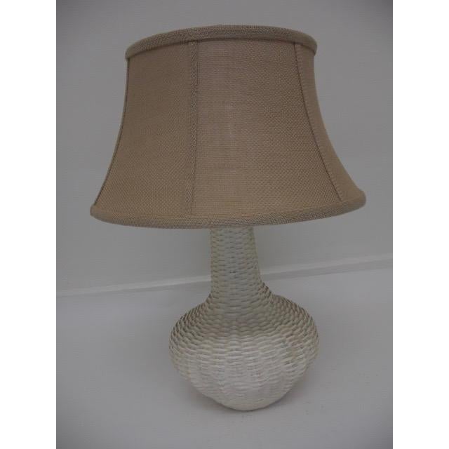 Detailed and crafted to look like a woven rattan, this vintage, ceramic table lamp offers effortless textural interest for...