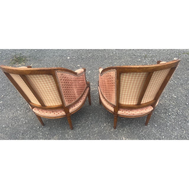 pair of vintage Michael Taylor Designs Incorporated barrel-back armchairs. Manufactured in San Francisco, California,...