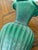 Design Plus Gallery presents a Green Ribbed Pottery Vase, an Antique Replica. The piece has a deep green glossy glazed...