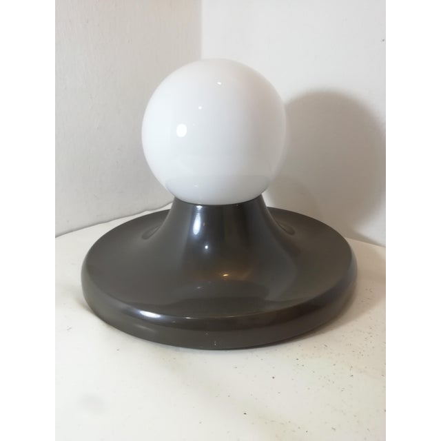 Beautiful ceiling lamp designed by the Castiglioni brothers for the Italian manufacturer Flos. Marked internally. Working....