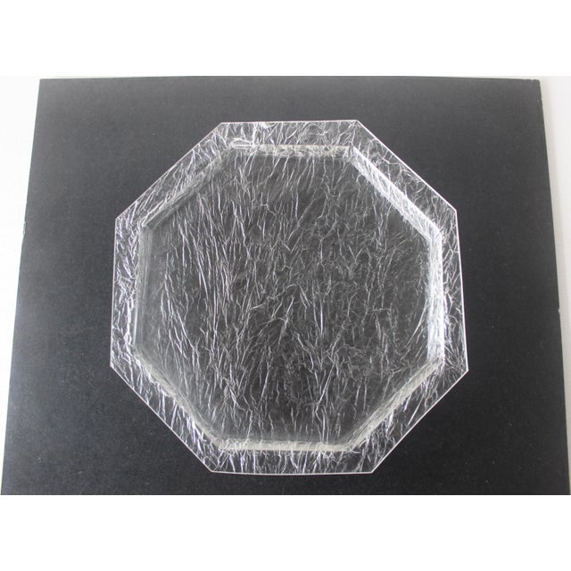This vintage octagonal serving tray is a collectible piece crafted from clear lucite with a "crackle" or "ice effect"...