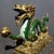 This striking vintage cloisonne enamel figurine depicts a dynamic sea dragon, a traditional symbol of power, strength, and...