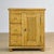 This pine cabinet dates from the early 20th century and is crafted from characteristic, weathered pine. Its warm, honey-...