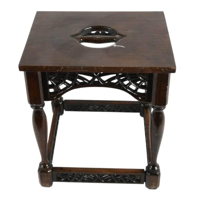 This signed F. W. Tyler hand-carved wooden stool dated 1943 is a distinctive example of handcrafted mid-20th-century...