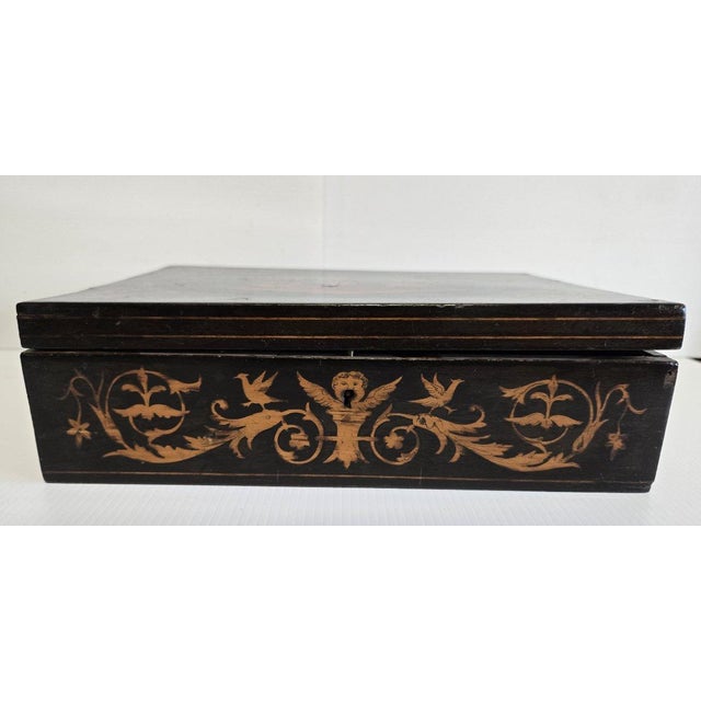 Sorrento marquetry box with a medallion scene of three dancers on the lid and a neoclassical frieze on all four sides....