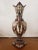 This Circa 1900 Bohemian Renaissance Revival Majolica Gryphon Handled Footed Vase. It measures 14 1/8" high, 8 1/4" wide...