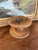 This likely antique industrial wooden spool originates from an early textile mill and showcases the utilitarian...