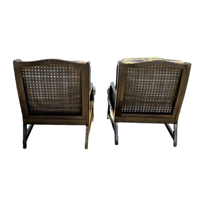 A handsome pair of vintage Henredon low-profile wingback lounge chairs featuring dark-finished oak wood frames, gracefully...