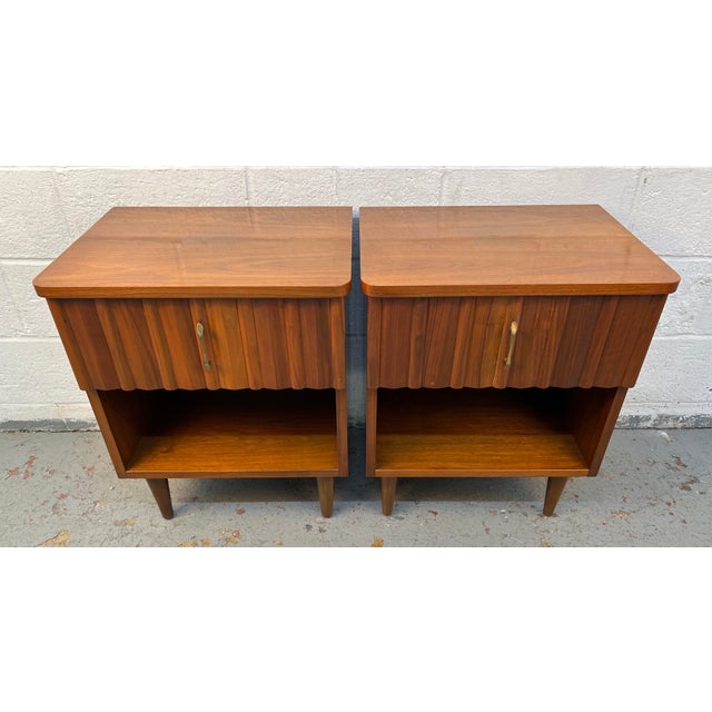 Timeless sophistication to your bedroom with this stunning pair of mid-century modern nightstands Attributed to Young...