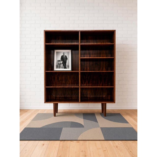 Omann Jun Rosewood bookcase manufactured in Denmark in the 1960s. This item sits at 142cm high and has 7 adjustable...