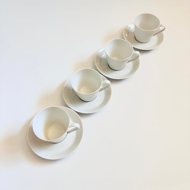 A set of 4 mid century porcelain teacups and saucers. Elegant minimalist design by Fairwood Schonwald, Germany. Finished...