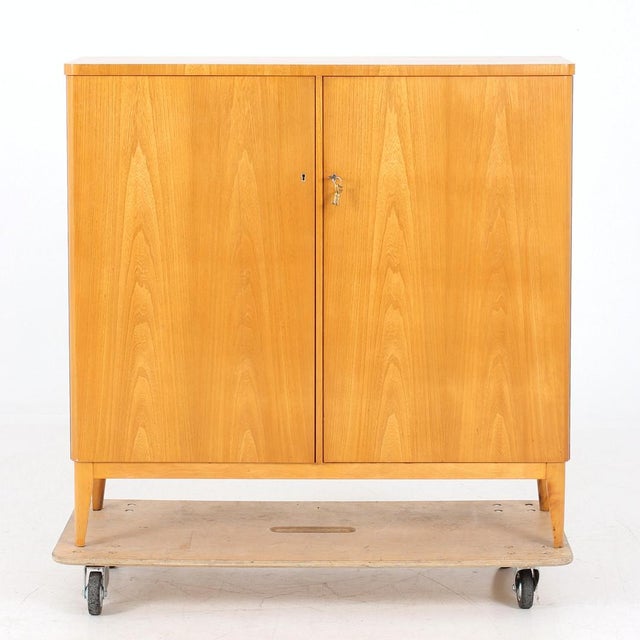 1940s quality cabinet in excellent condition. Beautiful light honey colored birch. Inside drawers and shelves. This piece...