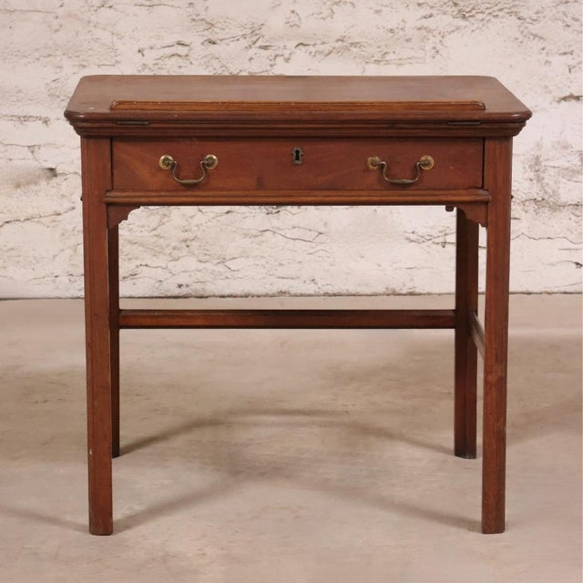 This 19th Century English Walnut Chippendale Desk is a distinguished antique showcasing the enduring elegance and...