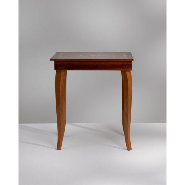 Mahogany side table in Rich Mahogany. Finished in rich mahogany, this mahogany side table is distinguished by curved sabre...