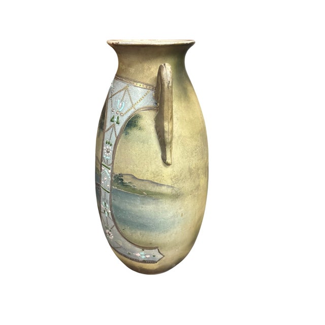 An exceptional pair of antique Japanese Nippon porcelain vases beautifully decorated in the celebrated Moriage technique....
