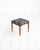 Scandinavian-made stool made of teak, with a padded seat upholstered in floral-patterned fabric. 1960s/1970s....