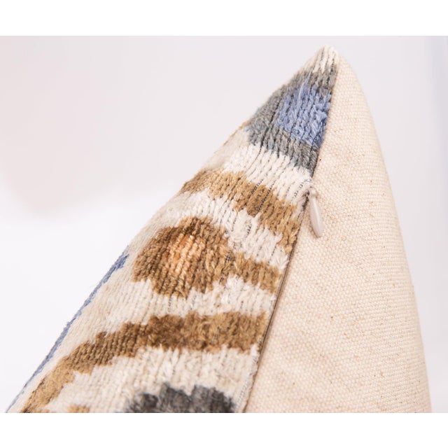 "Add a touch of global elegance to your home with this handmade silk velvet throw pillow, featuring a traditional Ikat-...