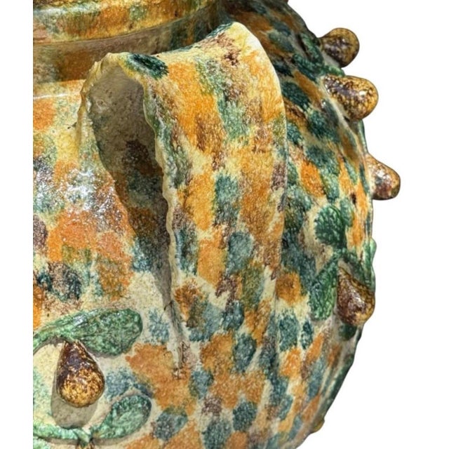 This striking vintage Italian Majolica terracotta planter urn brings an authentic touch of Mediterranean charm and rustic...