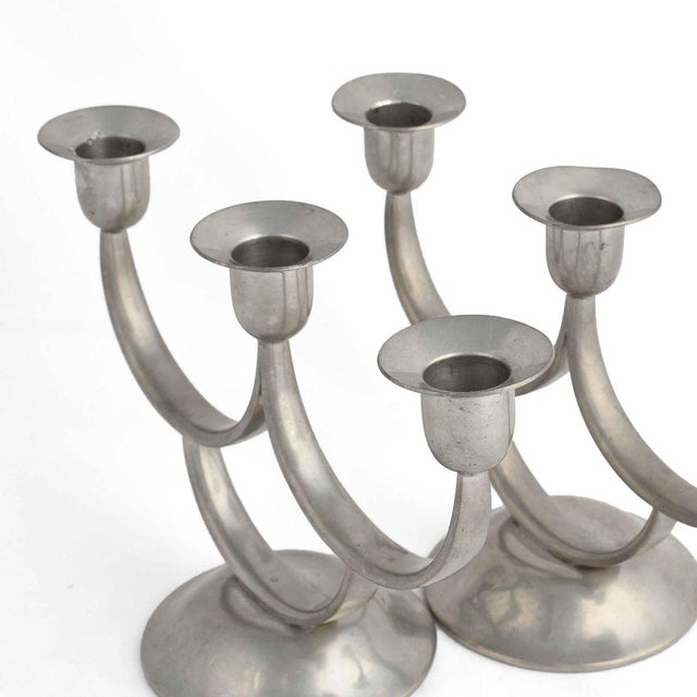 Pair of vintage Art Deco candelabras is a pair of original decorative objects realized in the 1930s. Designed by Harald...