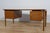 The desk was designed by the Danish designer Ib Kofod-Larsen, manufactured in the 1950s in the Swedish factory Seffle...