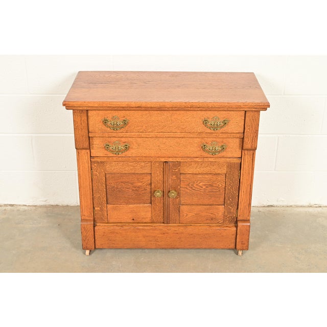 A beautiful antique Victorian commode, server, or bar cabinet In the era of Herter Brothers USA, Circa 1890s Quarter sawn...