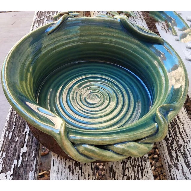 Bring tactile warmth and organic elegance to your tabletop with this striking, hand-thrown studio pottery serving bowl by...