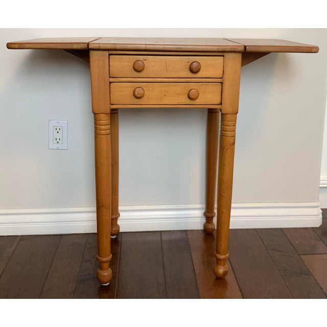 Late 19th Century Small Dropleaf Pine Side Table. Extended leaves measures 35" wide.