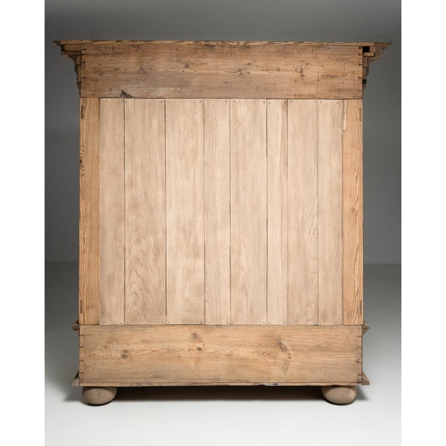 A rare example of French Baroque craftsmanship dating to circa 1800, this compact oak cabinet embodies the movement's...