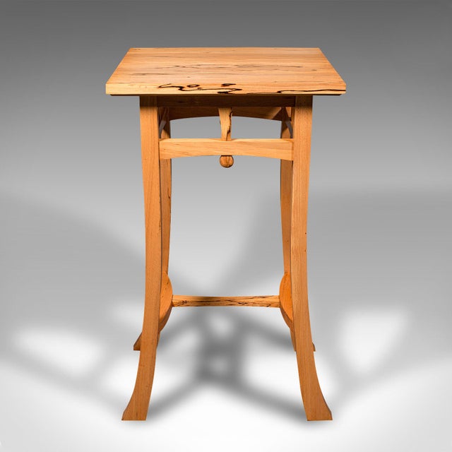 This is a contemporary jardiniere stand. An English, beech side table in Cotswold School taste. Beautifully presented...