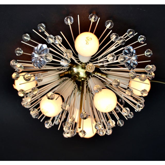 This wall or ceiling lamp was designed by Emil Stejnar in the 1950s and manufactured by Rupert Nikoll. The lamp features a...