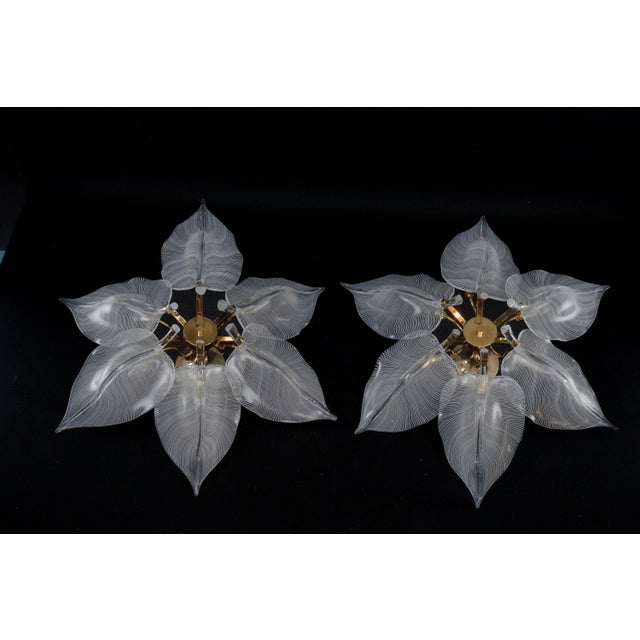 This remarkable offering includes a rare matching pair of large ceiling flush mounts featuring stunning, handcrafted...