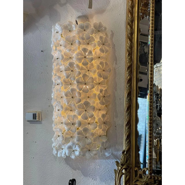 Decorative pair of large scale modern Murano flower sconces. Creates a gorgeous sculptural look and very fine quality as...