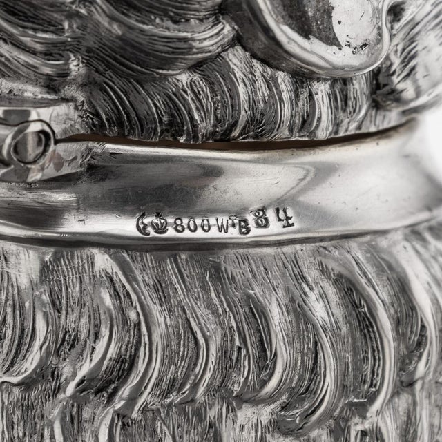 Antique early 20th century german solid silver & glass monkey shaped claret jug. The jug features a meticulously crafted...