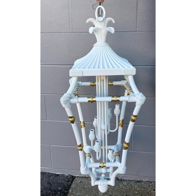 Discover an extraordinary piece of vintage elegance with this refurbished faux bamboo chandelier, expertly revitalized by...