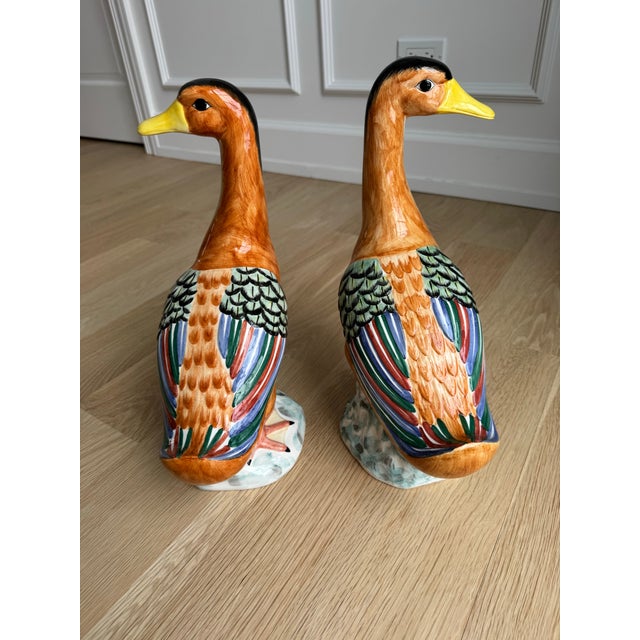 A vintage Italian, hand-painted polychrome ceramic Peking duck figurine pair by Mottahedeh. Executed in rich polychrome...