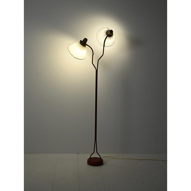 Mid-century floor lamp in turned teak and brass with three adjustable arms and adjustable heads. Elegant Scandinavian...