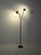 Mid-century floor lamp in turned teak and brass with three adjustable arms and adjustable heads. Elegant Scandinavian...