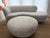 Sculptural curved sofa and ottoman in the style of Vladimir Kagan, featuring an elegant serpentine silhouette and fully...