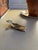 Whimsical vintage brass whale-form clip featuring a sculptural whale body and detailed tail fin that functions as a...