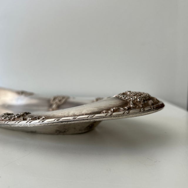 Antique silver-plated oval serving platter by Simpson, Hall, Miller & Co. of Wallingford, Connecticut. The platter...