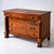 Large cherrywood chest of drawers with four drawers and metal escutcheons in the shape of coats of arms and wooden...