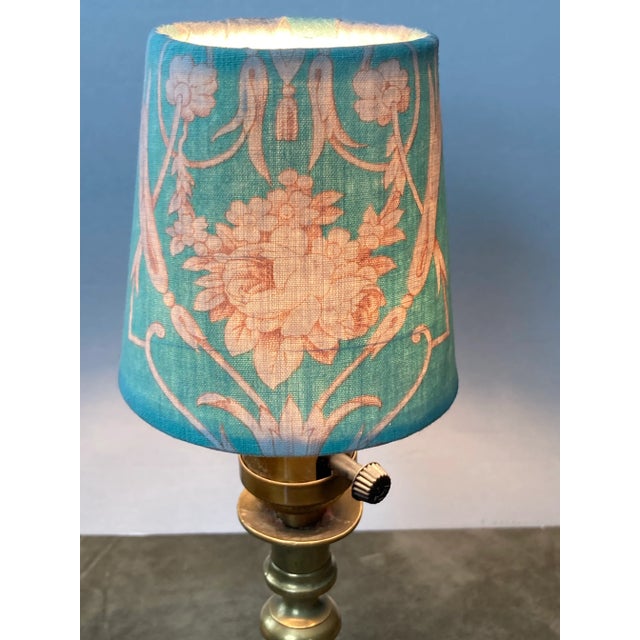 A chandelier shade handmade from a circa 1880‘s French printed textile. Measurements: top 3” side 4” bottom 4”