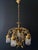 A beautiful antique chandelier. italy, 20th century. the chandelier is made of brass with bronze elements - magnificent...