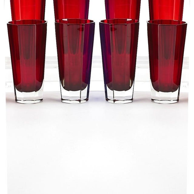 A striking example of mid-20th century modern design, this set of eight highball glasses features the distinctive Fabergé...