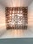 Elegant contemporary wall sconces made in amber-Rosè Murano glass “squared” elements. “Squared ” are blown inside a wooden...